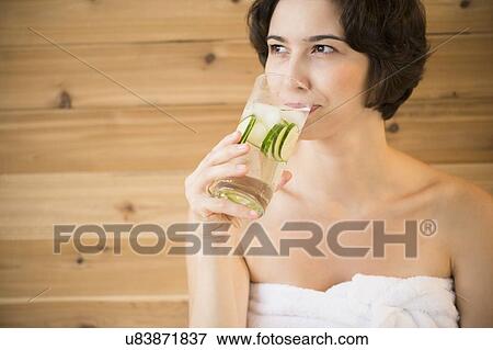 Woman drinking water in spa View Large Photo Image Stock Photo - Woman drinking water in spa. Fotosearch