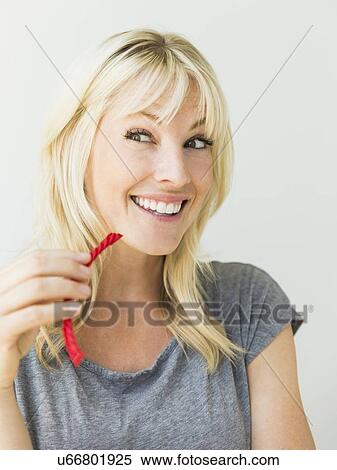 Woman eating candy View Large Photo Image Stock Photography - Woman eating candy. Fotosearch