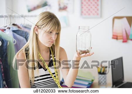 Woman holding empty savings jar View Large Photo Image Stock Image - Woman holding empty savings jar. Fotosearch