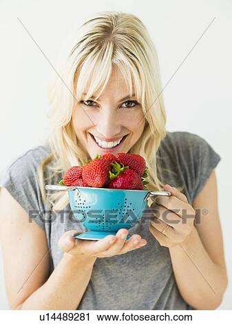Woman holding fresh strawberries View Large Photo Image Stock Image - Woman holding fresh strawberries. Fotosearch