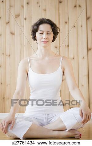 Picture - Woman meditating in spa. Fotosearch