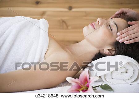 Woman receiving massage in spa View Large Photo Image Stock Photo - Woman receiving massage in spa. Fotosearch
