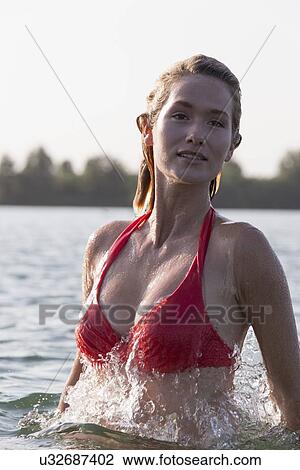 Woman relaxing in lake, Looking at camera View Large Photo Image Stock Image - Woman relaxing in lake, Looking at camera. Fotosearch