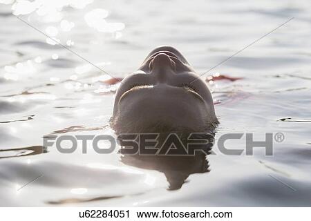 Woman relaxing in lake View Large Photo Image Stock Image - Woman relaxing in lake. Fotosearch