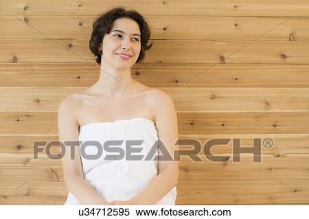 Woman relaxing in sauna View Large Photo Image Stock Photography - Woman relaxing in sauna. Fotosearch