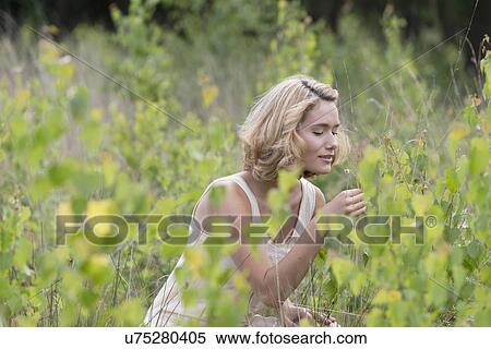 Woman relaxing on meadow View Large Photo Image Stock Photography - Woman relaxing on meadow. Fotosearch