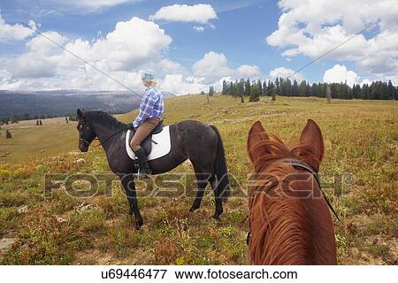 Woman riding horse View Large Photo Image Stock Photo - Woman riding horse. Fotosearch