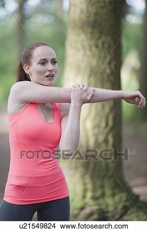 Woman stretching in forest View Large Photo Image Picture - Woman stretching in forest. Fotosearch