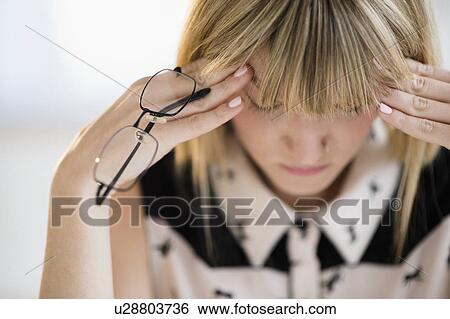 Woman with head in hands View Large Photo Image Stock Photograph - Woman with head in hands. Fotosearch
