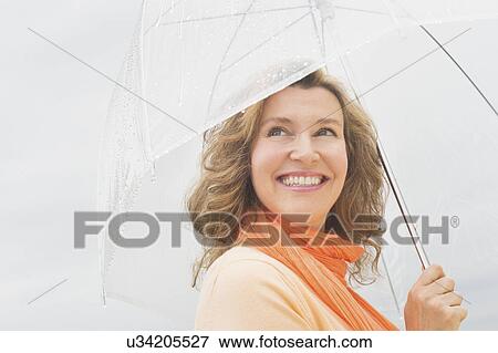 Woman with umbrella View Large Photo Image Stock Photo - Woman with umbrella. Fotosearch