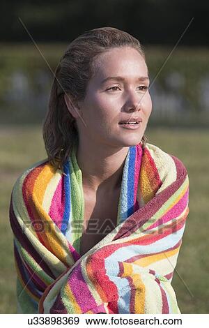 Woman wrapped in stripped towel View Large Photo Image Stock Photo - Woman wrapped in stripped towel. Fotosearch