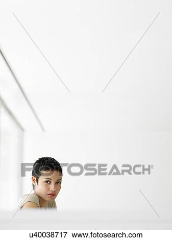Stock Photo - Businesswoman in office portrait. Fotosearch