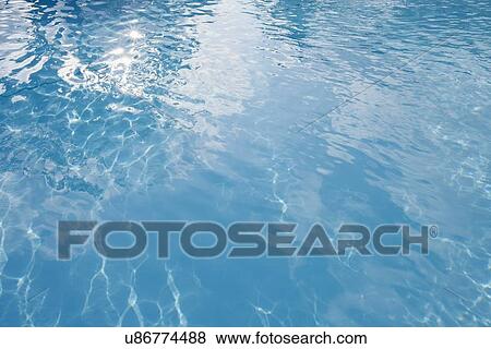 Stock Photo - Clear blue water in swimming pool, Koh Pha Ngan, Thailand. Fotosearch