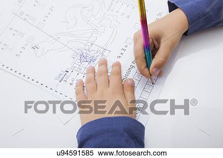 Close-up of boy's hand writing on paper View Large Photo Image Stock Photography - Close-up of boy's hand writing on paper. Fotosearch