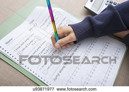 Close-up of girl's hand writing on paper View Large Photo Image Stock Photo - Close-up of girl's hand writing on paper. Fotosearch