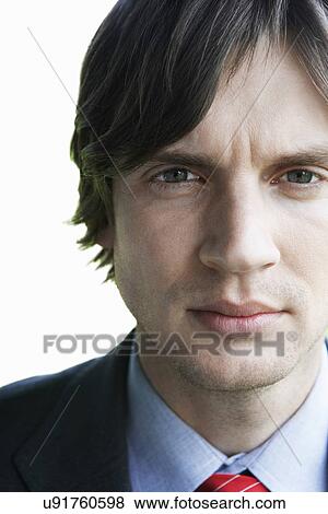 Stock Photo - Close-up of young businessman over white background. Fotosearch
