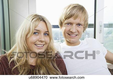 Close-up portrait of blue eyed smiling couple at home View Large Photo Image Stock Image - Close-up portrait of blue eyed smiling couple at home. Fotosearch