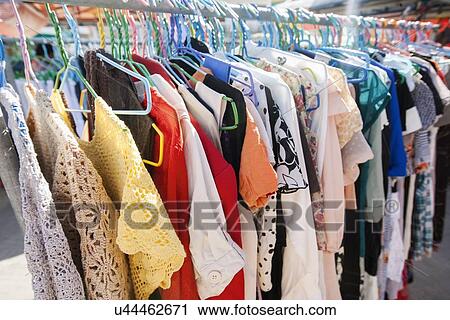 Stock Image - Clothing on display racks, Koh Pha Ngan, Thailand. Fotosearch