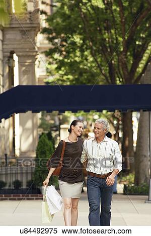 Stock Photography - Couple walking in city. Fotosearch