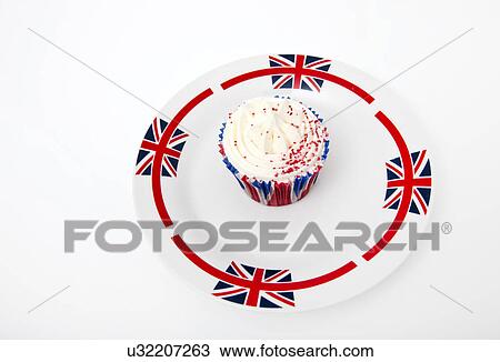 Stock Image - Cupcake in Union Jack plate against white background. Fotosearch