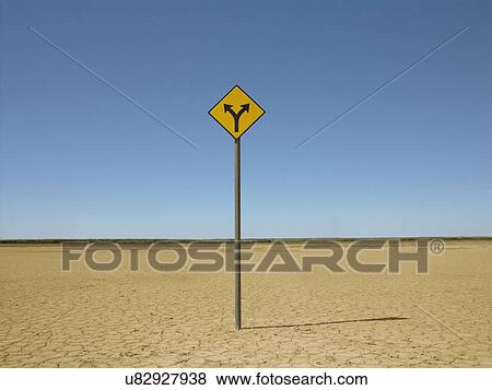 Stock Photo - Double arrow sign on arid landscape. Fotosearch