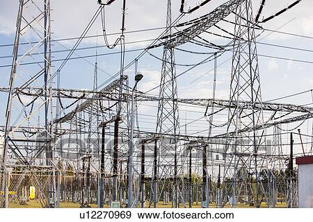 Electric pylons at power plant View Large Photo Image Stock Photo - Electric pylons at power plant. Fotosearch