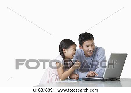 Father and daughter playing with laptop on kitchen counter View Large Photo Image Stock Image - Father and daughter playing with laptop on kitchen counter. Fotosearch