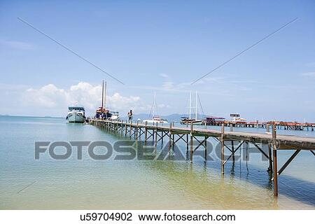 Stock Image - Ferry moored at Na Pra Lan Pier, Koh Samui, Thailand. Fotosearch