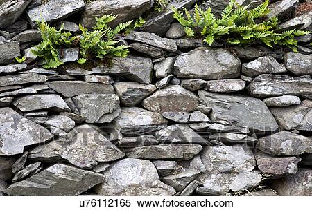 Stock Photography - Full frame shot of stone wall. Fotosearch
