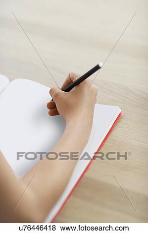 Girl doing geometry homework on table close up of hand View Large Photo Image Stock Photo - Girl doing geometry homework on table close up of hand. Fotosearch