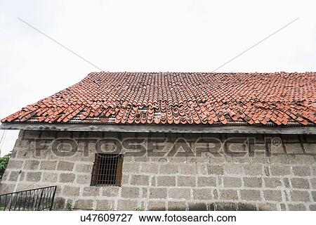 House with tiled roof and stone wall in Manila, Philippines View Large Photo Image Stock Photo - House with tiled roof and stone wall in Manila, Philippines. Fotosearch