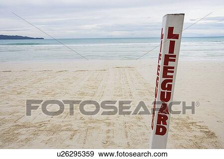 Stock Photo - Lifeguard written on pole at Boracay beach, Philippines. Fotosearch