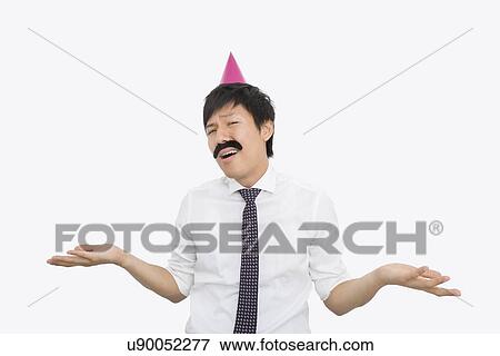 Mid adult businessman shrugging his shoulders over white background View Large Photo Image Stock Photo - Mid adult businessman shrugging his shoulders over white background. Fotosearch