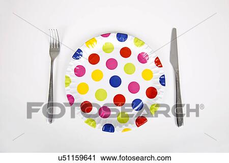 Multicolored plate with polka dots and cutlery against white background View Large Photo Image Stock Image - Multicolored plate with polka dots and cutlery against white background. Fotosearch