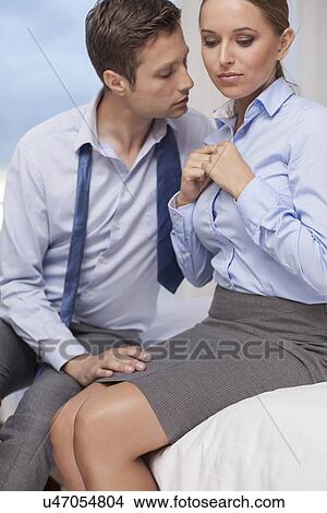 Passionate business couple in hotel room View Large Photo Image Picture - Passionate business couple in hotel room. Fotosearch