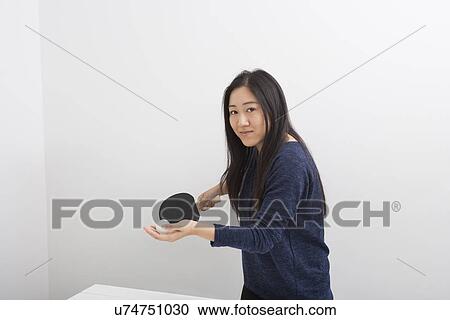 Portrait of beautiful young woman preparing to serve table tennis ball View Large Photo Image Stock Image - Portrait of beautiful young woman preparing to serve table tennis ball. Fotosearch