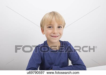 Stock Photo - Portrait of boy smiling. Fotosearch