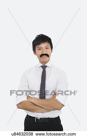 Portrait of confident businessman with fake mustache over white background View Large Photo Image Stock Photo - Portrait of confident businessman with fake mustache over white background. Fotosearch