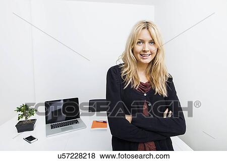 Stock Photo - Portrait of confident businesswoman in office. Fotosearch