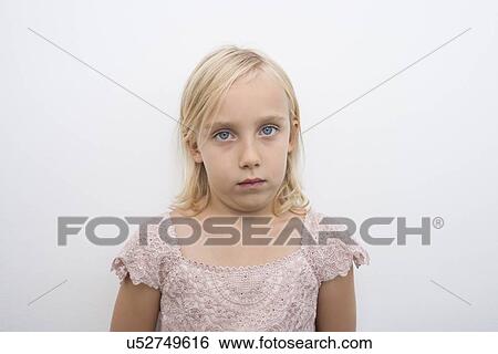 Stock Photograph - Portrait of girl staring over white background. Fotosearch