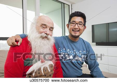 Portrait of grandson and grandfather smiling in house View Large Photo Image Stock Image - Portrait of grandson and grandfather smiling in house. Fotosearch