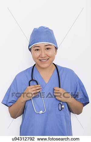 Portrait of happy female doctor with stethoscope around neck against white background View Large Photo Image Stock Image - Portrait of happy female doctor with stethoscope around neck against white background. Fotosearch