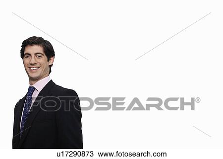 Portrait of happy young businessman against white background View Large Photo Image Stock Image - Portrait of happy young businessman against white background. Fotosearch