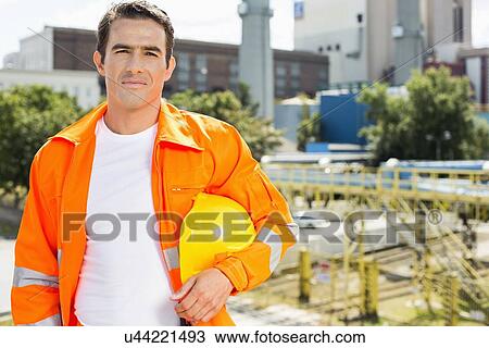 Portrait of male architect wearing reflective workwear at construction site View Large Photo Image Stock Image - Portrait of male architect wearing reflective workwear at construction site. Fotosearch