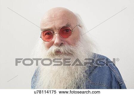 Portrait of senior man wearing red glasses over gray background View Large Photo Image Stock Photography - Portrait of senior man wearing red glasses over gray background. Fotosearch