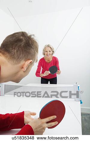 Portrait of senior woman playing table tennis in court View Large Photo Image Stock Photo - Portrait of senior woman playing table tennis in court. Fotosearch