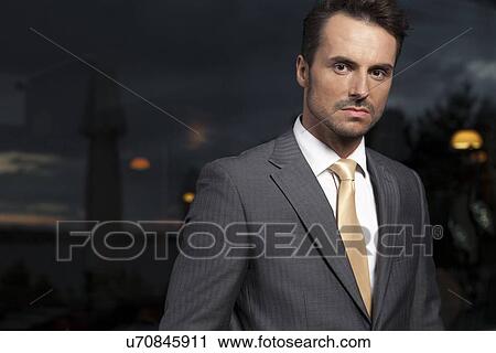 Portrait of serious businessman in office View Large Photo Image Stock Image - Portrait of serious businessman in office. Fotosearch