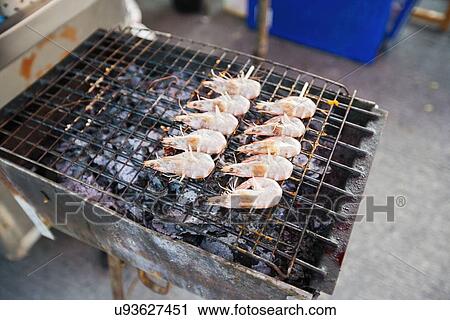 Stock Image - Prawns cooking on barbecue, Koh Pha Ngan, Thailand. Fotosearch