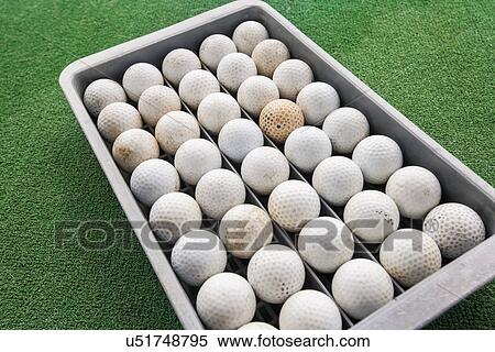Rows of golf balls in tray on green, Koh Pha Ngan, Thailand View Large Photo Image Stock Photography - Rows of golf balls in tray on green, Koh Pha Ngan, Thailand. Fotosearch