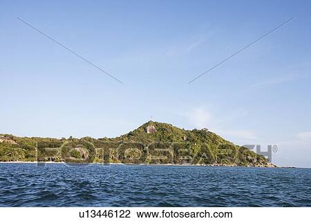 Stock Image - Seascape with island in background, Koh Pha Ngan, Thailand. Fotosearch